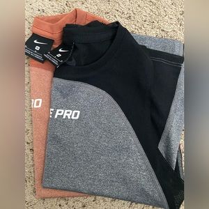 Two Nike Pro Women’s Crop Workout Top